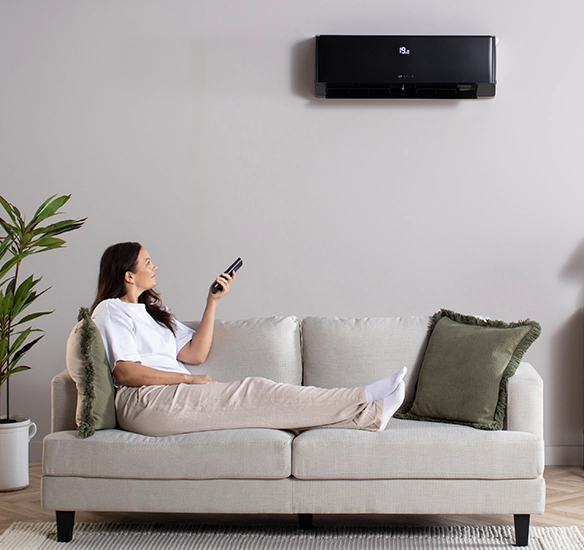 woman turning on Air con